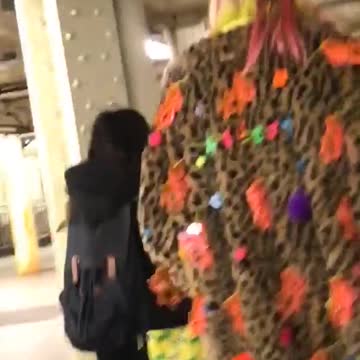 Following a person with cheetah print jacket