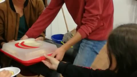 Guy tries to leave red shirt drops cake door
