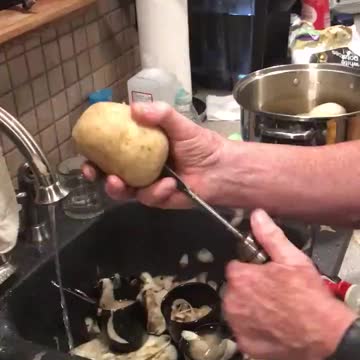 Peeling potatoes with a drill.
