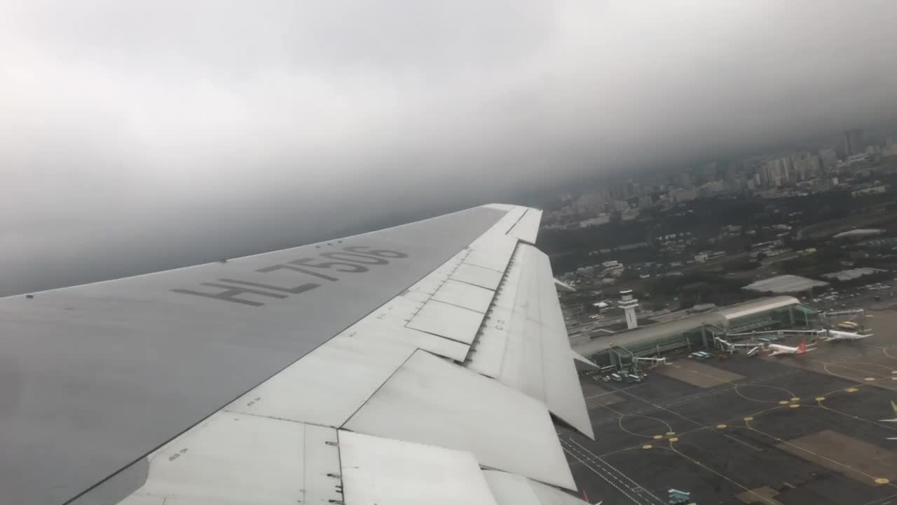 a plane taking off on a cloudy day