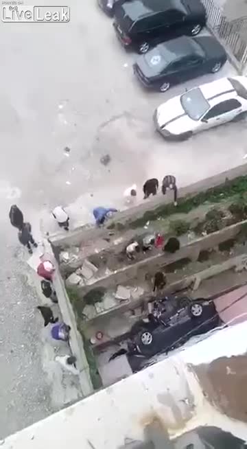 A female driver falls off the buildings roof uses as cars parking (2)