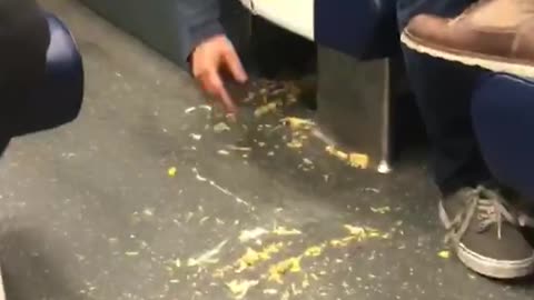 Man drop s chips brushes them under train chiar