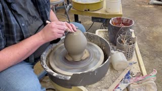 Making a Pitcher/Jug on the Pottery Wheel. Trimming the Bottom