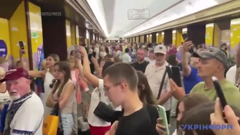 Kyiv residents sing city's anthem in subway as air raid sirens go off