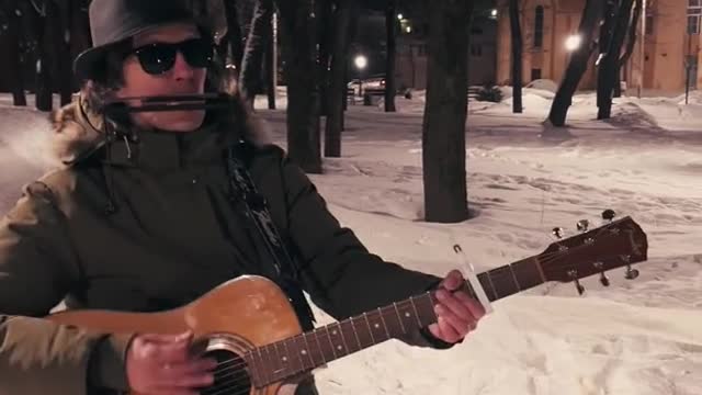 Street Musician Playing Guitar and Harmonica Background Video 4k