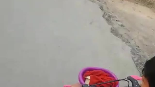 Indian Little Cute Baby Cycling On Villege Road