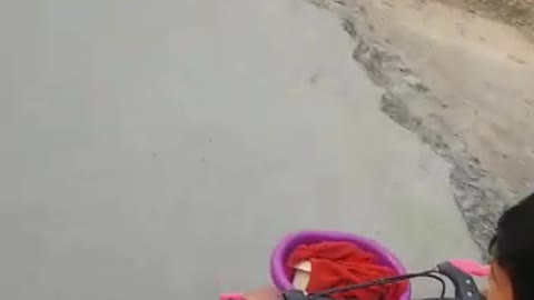Indian Little Cute Baby Cycling On Villege Road