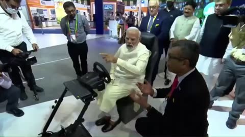 PM Modi driving a car in Europe while seated in India through 5G network. Check out the video