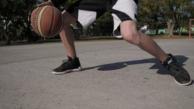 Basketball player dribbling ball