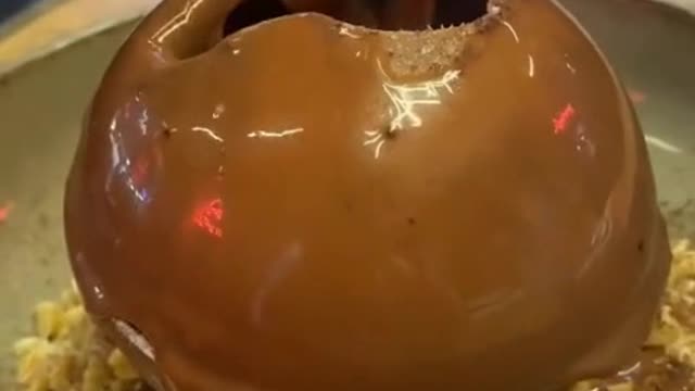 Pouring a ball of chocolate cake