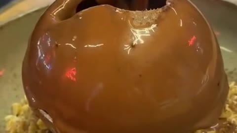 Pouring a ball of chocolate cake