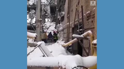 Ukrainian emergency workers clear rubble from airstrike