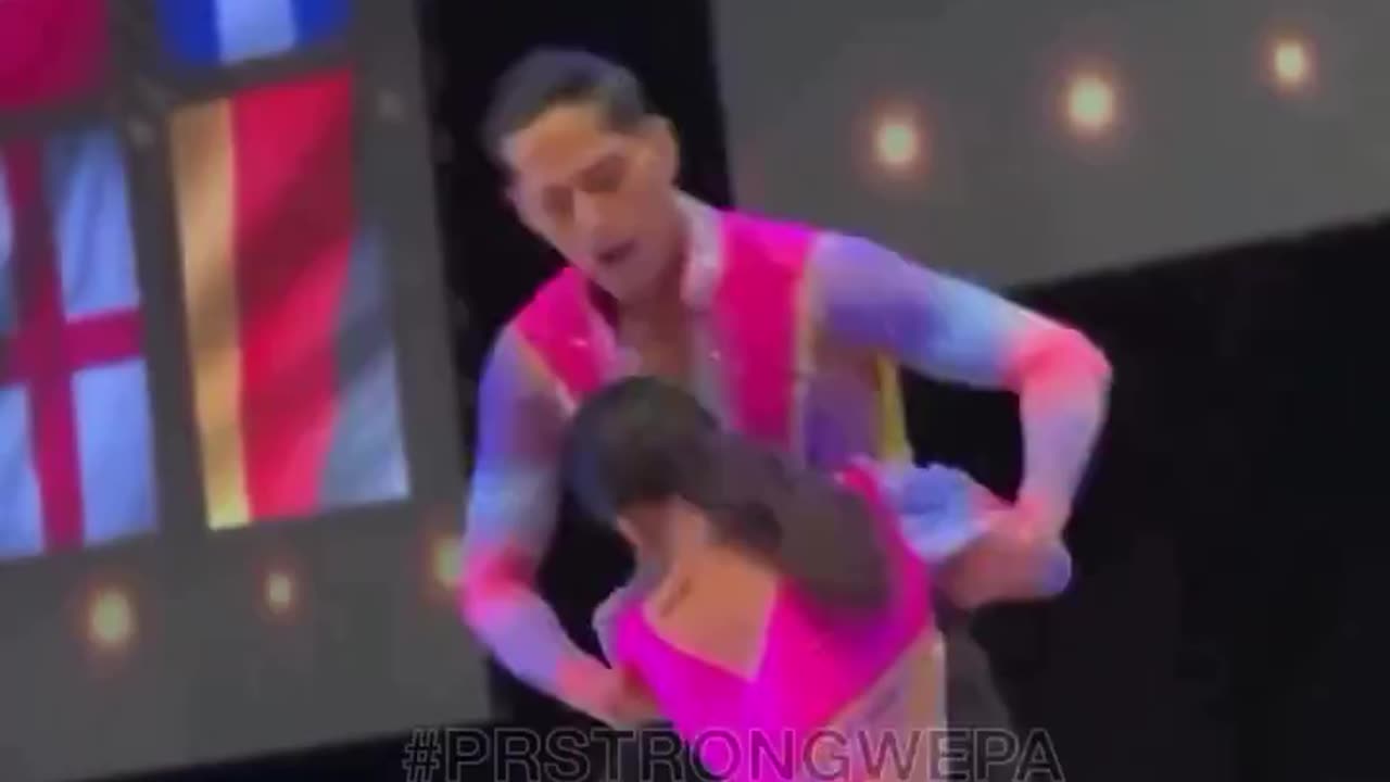 Woman falls in dance contest, keeps smiling