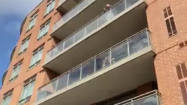 Grandchildren Visit Outside Quarantined Grandma's Building to Wish her Happy Birthday