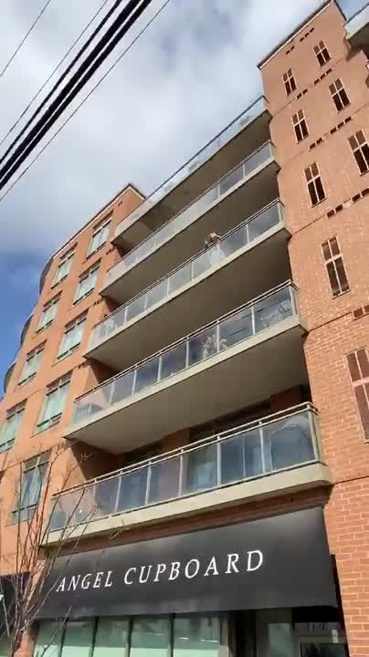 Grandchildren Visit Outside Quarantined Grandma's Building to Wish her Happy Birthday