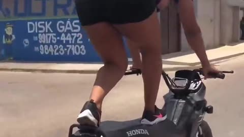 Biker girl performs stunt