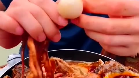 Chinese fisherman cooking and eating.