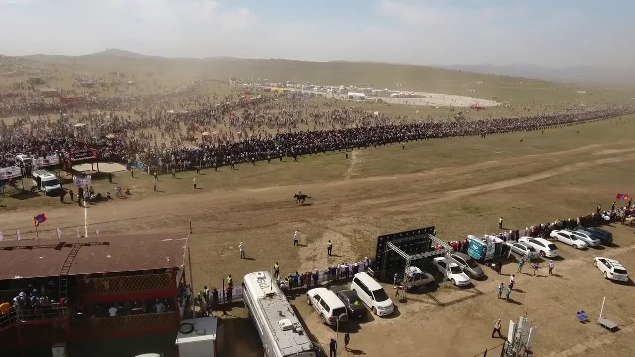 Aerial drone shot during naadam festival horse race finishing line Mongolia