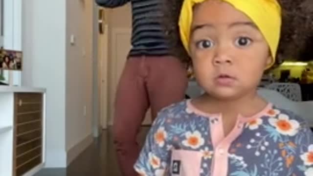 Little girl adorably dances with her dad on camera