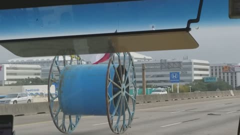 Giant Spool Rolls Down Freeway