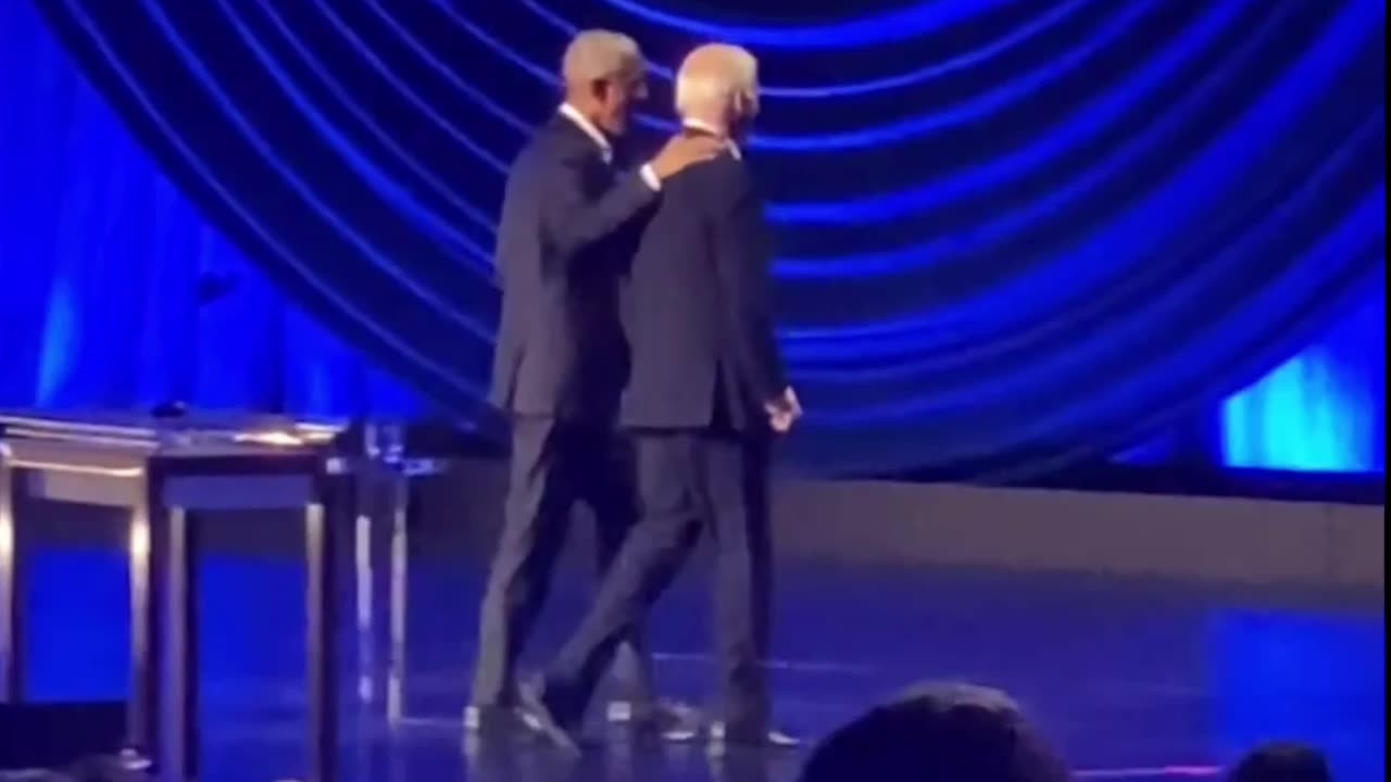 Obama ushers Biden off stage after he Froze up again.