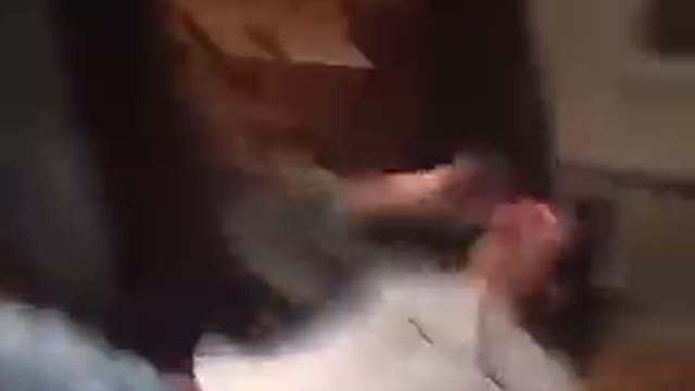 Guy grey shirt falls down and hits head on table