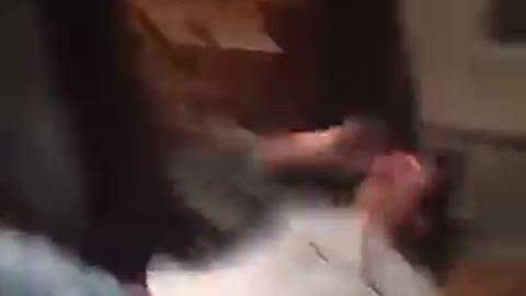 Guy grey shirt falls down and hits head on table