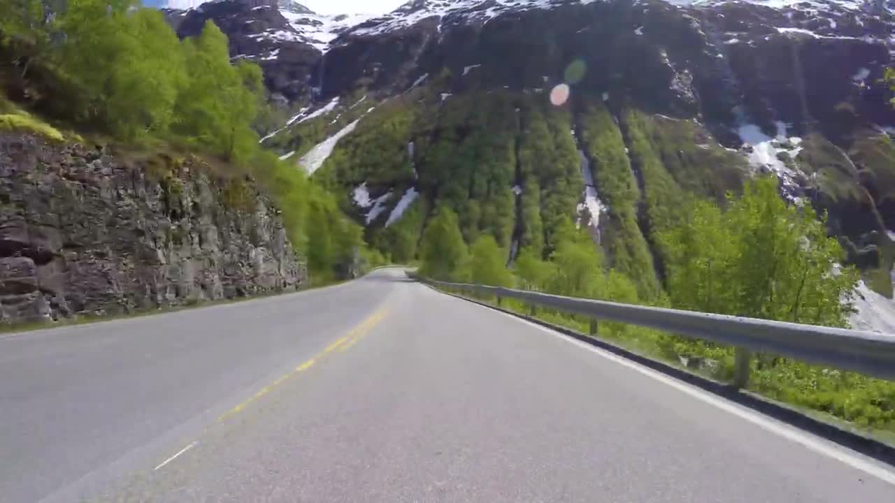 Scenic drive, point of view, through the snow capped mountain of Norway.