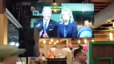 The bar explodes with Boos when Biden come on TV