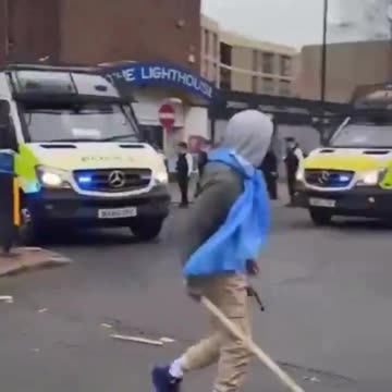 Migrants clashing with police officers in south London
