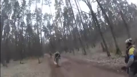 Ukrainian soldiers running after hearing artillery fire