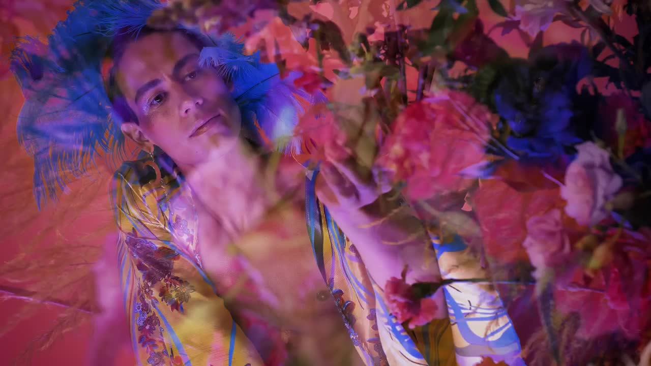 Concept video of an LGBTQ man surrounded by flowers