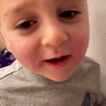 Silly boy put glue on his face and tried to wipe it off with toilet paper