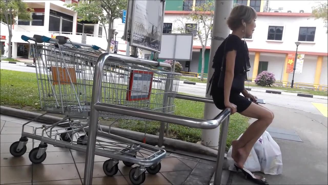 Waiting for her ride...after grocery shopping!