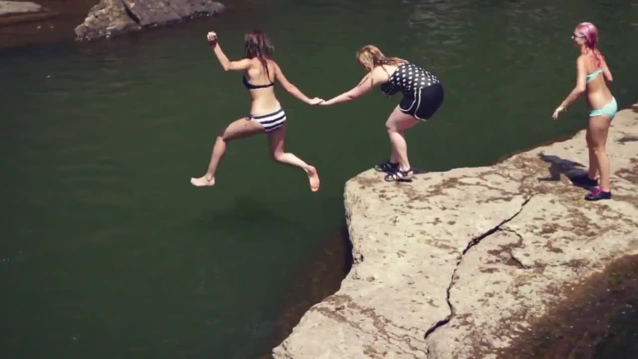 Cliff jumping by friends