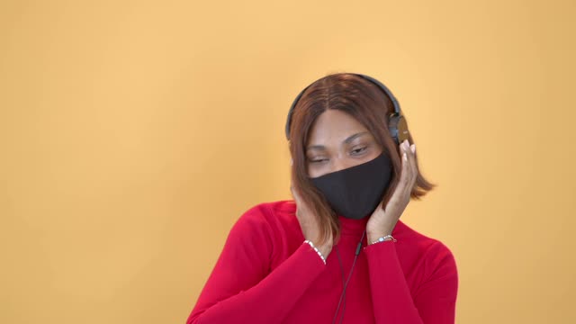 A Woman Dancing while Listening to Music