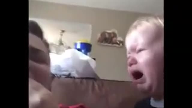 Baby and mom laughing at each other.