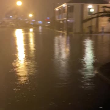 Hurricane Nicholas on SV Imagine flooding marina parking lot and more.