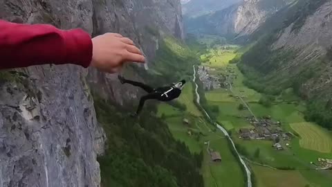 Stunt Men parashuting from the top of a mountain ⛰️