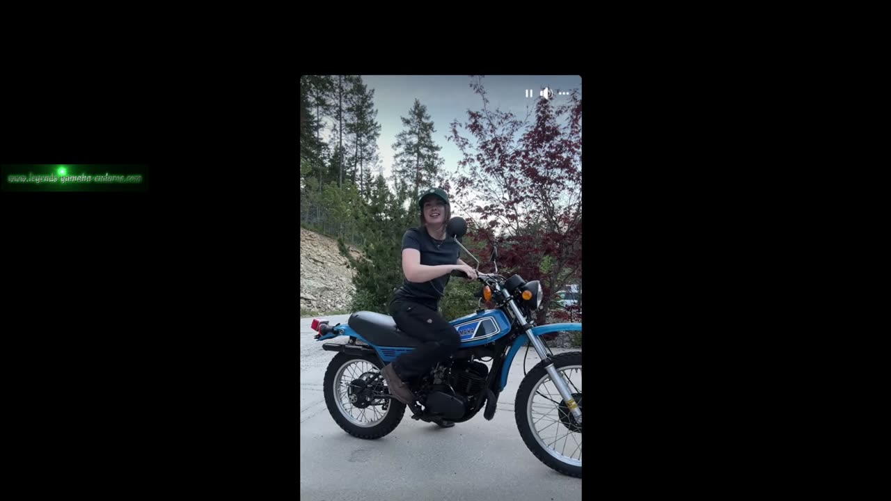 A woman starts a 1977 Yamaha DT250D