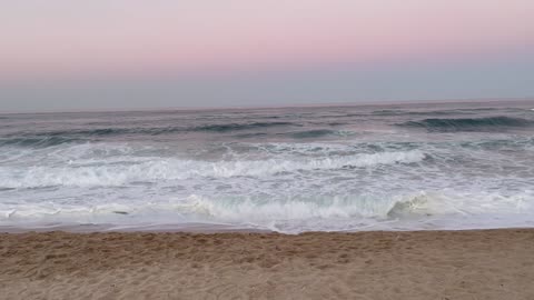 Pink sky and blue sea