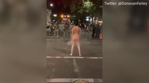 'Naked Athena' Portland protester dares police to shot tear gas at her