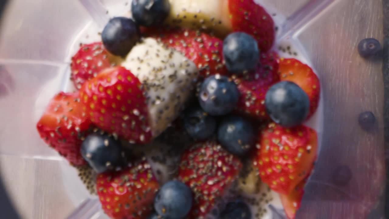 Overhead Strawberry Smoothie Ingredients in Blender