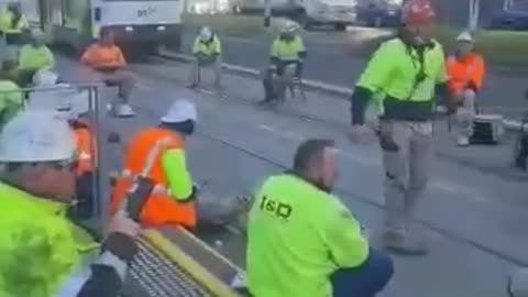 Construction workers stage sit in to protest vaccine mandates in Australia