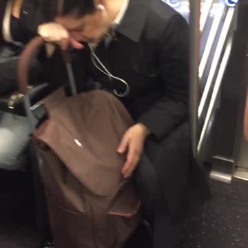 Three people falling asleep on subway train