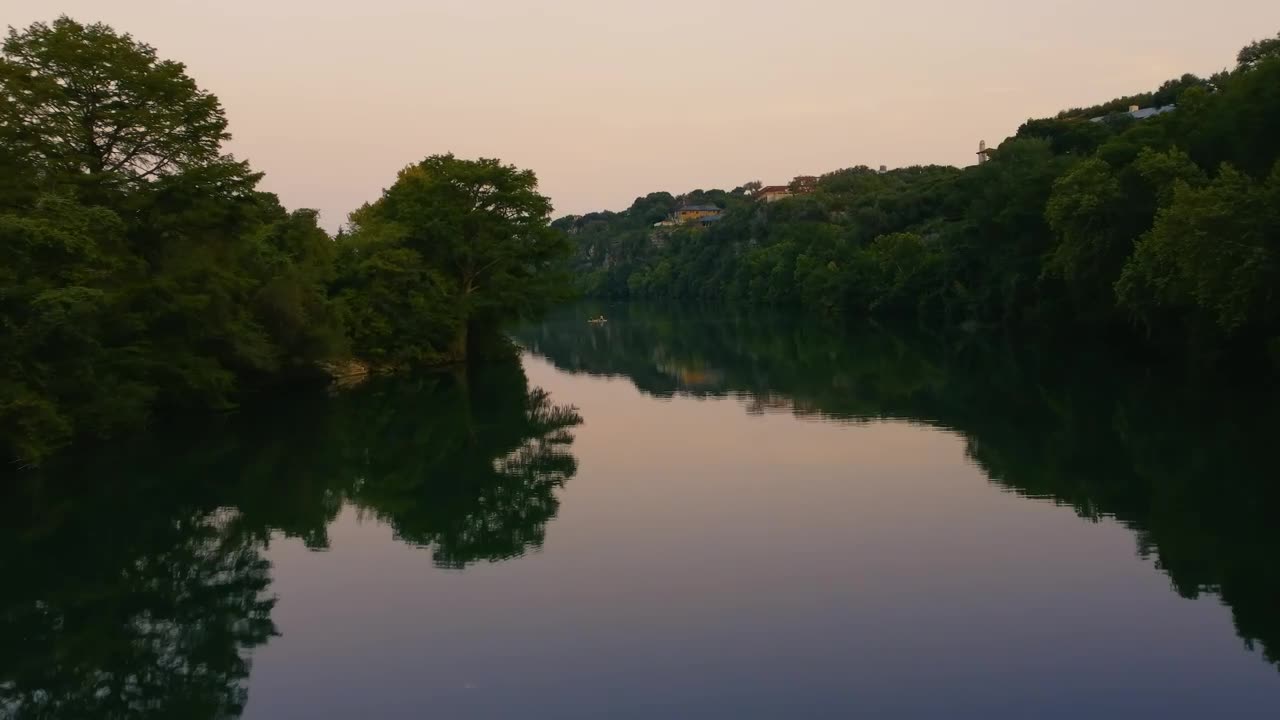 Flying low over a large river in nature