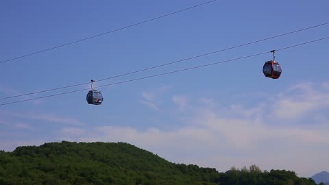 a cable car moving on a mountain