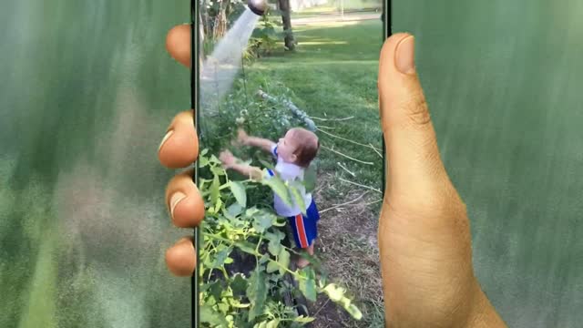 Cute baby playing with water video