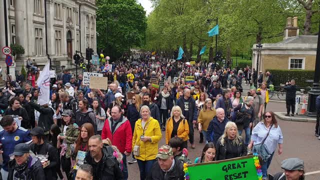 A flock of anti covid vaccine banners at the London worldwide protest against the plandemic