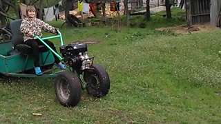 Daughter on a walk-behind tractor